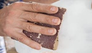 polish marble with sandpaper
