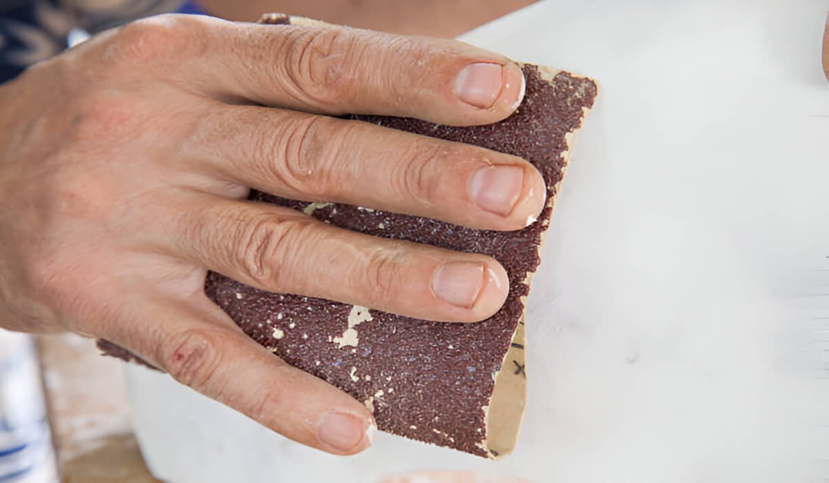 polish marble with sandpaper